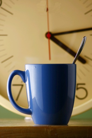 Blue coffee mug and a clockの素材