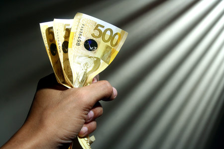 Hand holding money