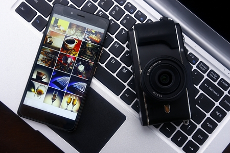 Smartphone,digital mirrorless camera and laptop computerの写真素材