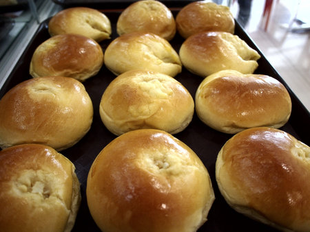 Freshly baked bread and pastries on display at a bakeshop.
