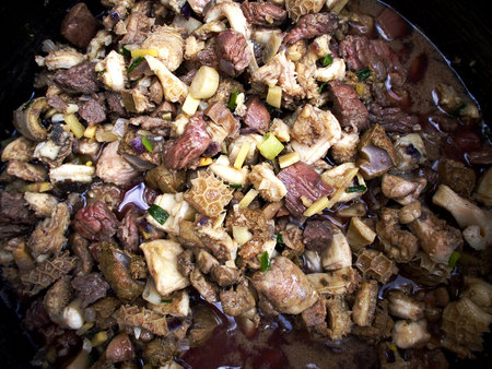 Chopped raw beef meat and innards ready to be cooked in a pot