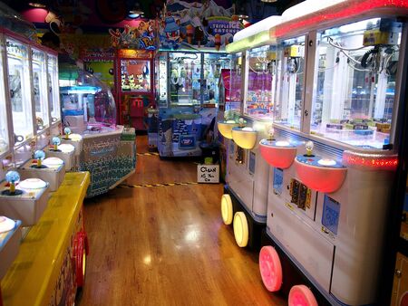 Games and attractions inside an amusement arcadeの素材