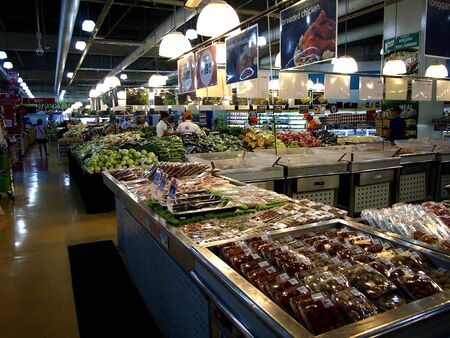 Assorted fruits and vegetables at a grocery storeの素材
