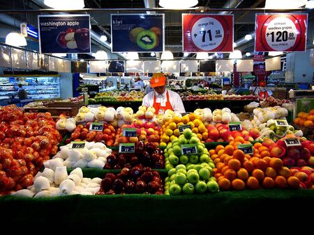 Assorted fruits and vegetables at a grocery storeの素材