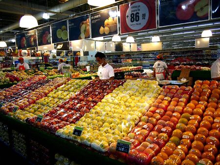 Assorted fruits and vegetables at a grocery storeの素材