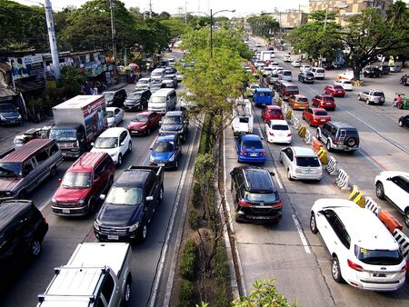 Vehicles along Katipunan Avenue in Quezon City, Philippinesの素材