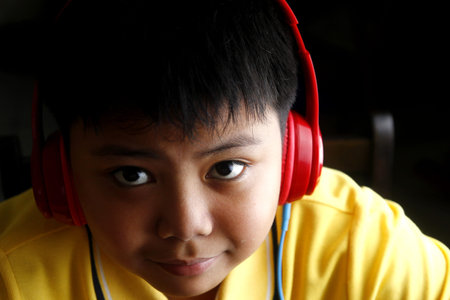 Young Asian boy with headphones