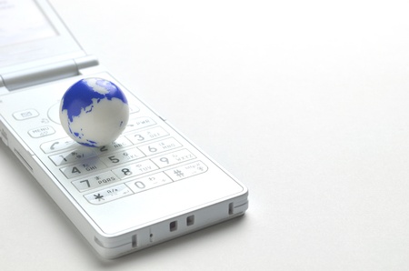 mobile phone and earthの写真素材