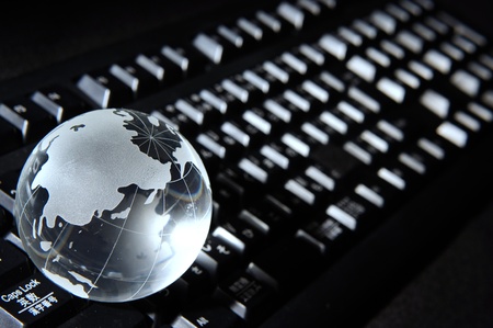 Blue Globe and Computer Keyboard for backgroundの写真素材