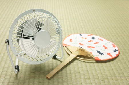 electric fan  and  uchiwaの写真素材
