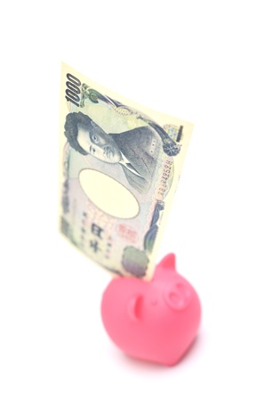 piggy bank and japanese moneyの写真素材