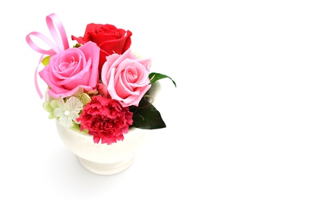 Bunch of pink roses and red isolated on whiteの写真素材
