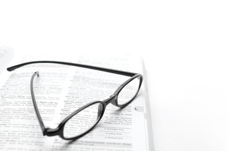 Open book and glassesの写真素材
