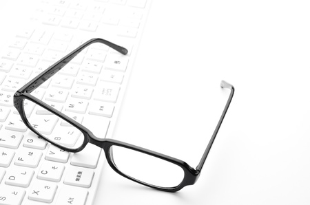 Glasses and keyboardの写真素材
