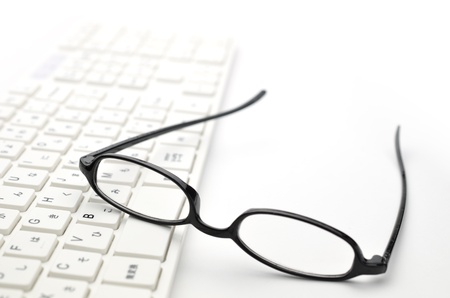 Glasses and keyboardの写真素材
