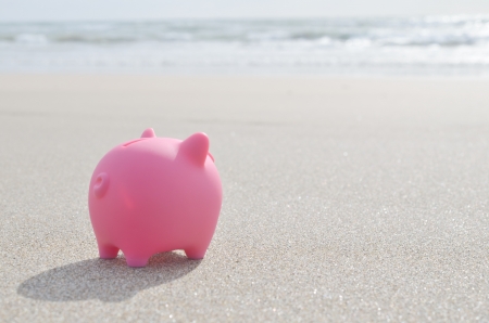 piggy bank on beachの写真素材