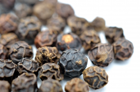 Black pepper isolated on white backgroundの写真素材