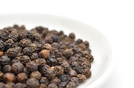 Black pepper isolated on white backgroundの写真素材