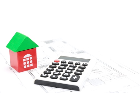 Model house and calculator on construction planの写真素材