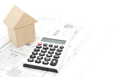 Model house and calculator on construction planの写真素材