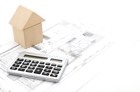 Model house and calculator on construction planの写真素材