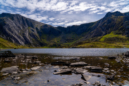 Breathtaking View of Lake Llyn Idwal Framed by Glyderau Mountain Range in the Legendary Ice-Carved Cwm Idwal of North Eryri (Snowdonia)の写真素材