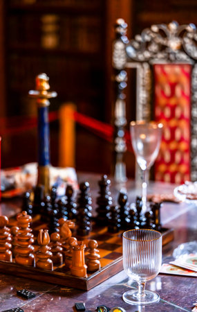 Luxurious Vintage Chess Setup in an Elegant Royal Setting with Ornate Glassware and Regal Atmosphere