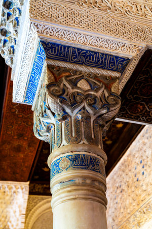 Exquisite Islamic Calligraphy and Ornate Geometric Designs on Alhambraâs Historic Pillar in Granada, Spainの写真素材