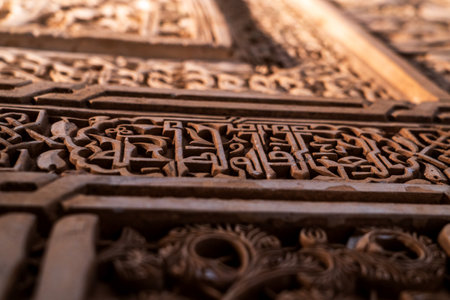 Ornate Knotted Kufic Calligraphy and Stucco Relief Showcasing Alhambraâs Moorish Artistic Heritageの写真素材