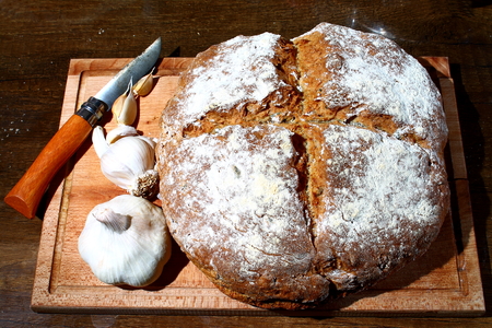Traditional homemade bread served with garlicの写真素材