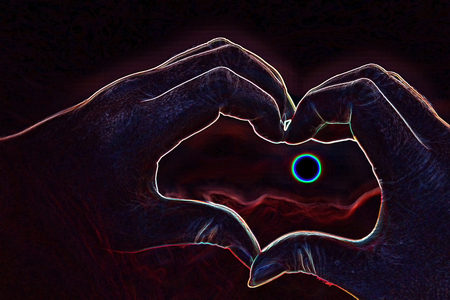 Abstract hand in the shape of a heart on the backgroundの写真素材