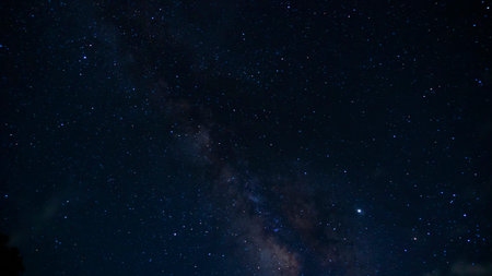 Time lapse of galaxies and meteor at night