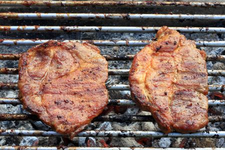 Barbecued steak on the grill.の写真素材