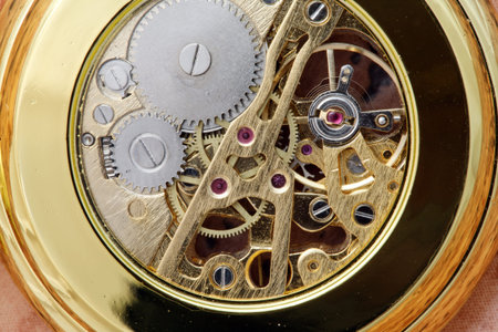Close-up shot of gear coupling in pocket watch.