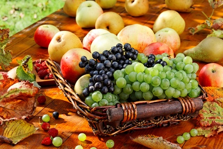 Basket of ripe fruits on the table.の写真素材