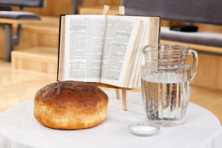 Thanksgiving day bread, water and  the bible on the table.