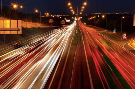 Car lights on the night highway