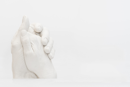 Statue of two tangled handsの写真素材