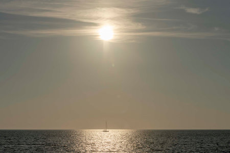 Nice sunset with shining sun with rays on Mali Losinj in Croatiaの写真素材