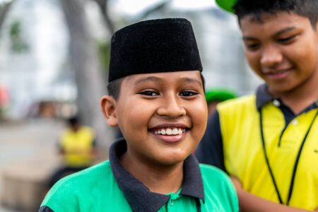 Penang, Malaysia 10 12 2018: Happy boy in a traditional Muslim cap smilingのeditorial素材