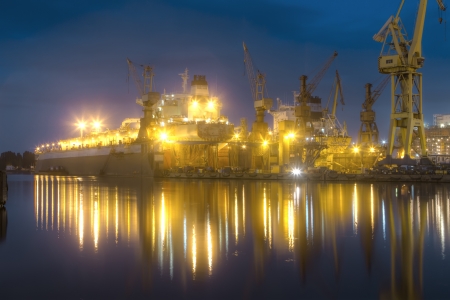 A hull of a ship is being renovated in a dry dockのeditorial素材