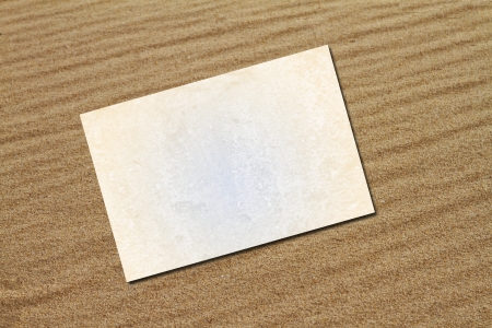 Blank card on beach sandの写真素材