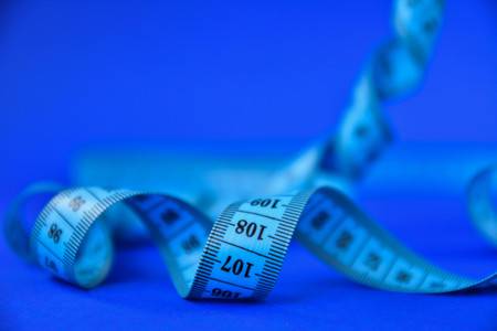 centimeter tape on a blue background. art soft focusの写真素材