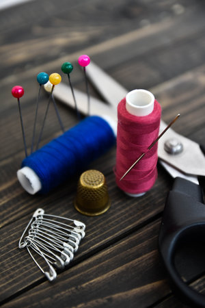 Sewing tools collection. Isolated on brown. art soft focus