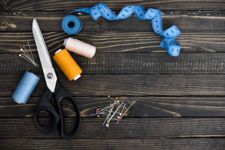 Sewing tools collection. Isolated on brown. art soft focus