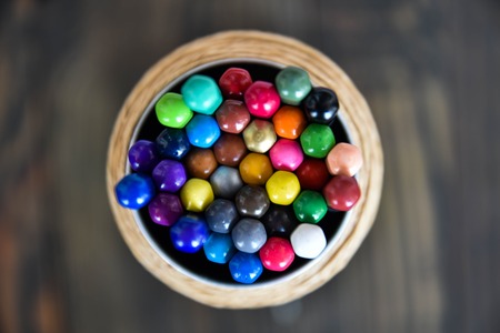 colored pencils on a wooden brown backgroundの写真素材