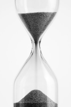 Sand watch over white background