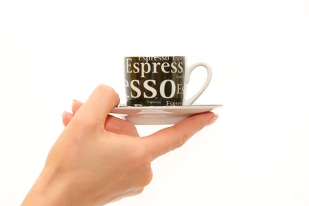 Woman's hand holding espresso coffee cupの写真素材