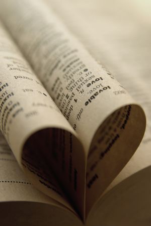 Heart made of rolled up pages of the bookの写真素材