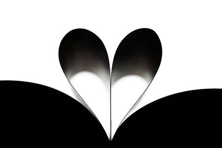 Heart made of rolled up pages of the bookの写真素材